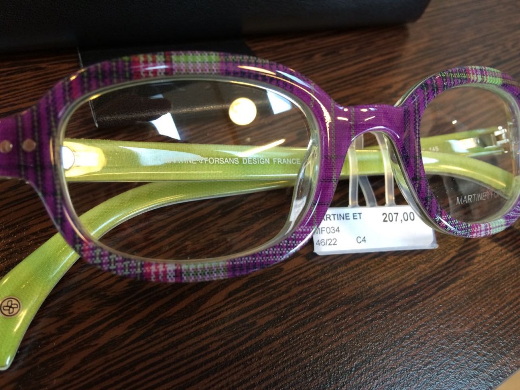 Eyeglass frames with fabric embedded in the plastic.